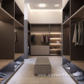 open wardrobe with wooden closet in bedroom